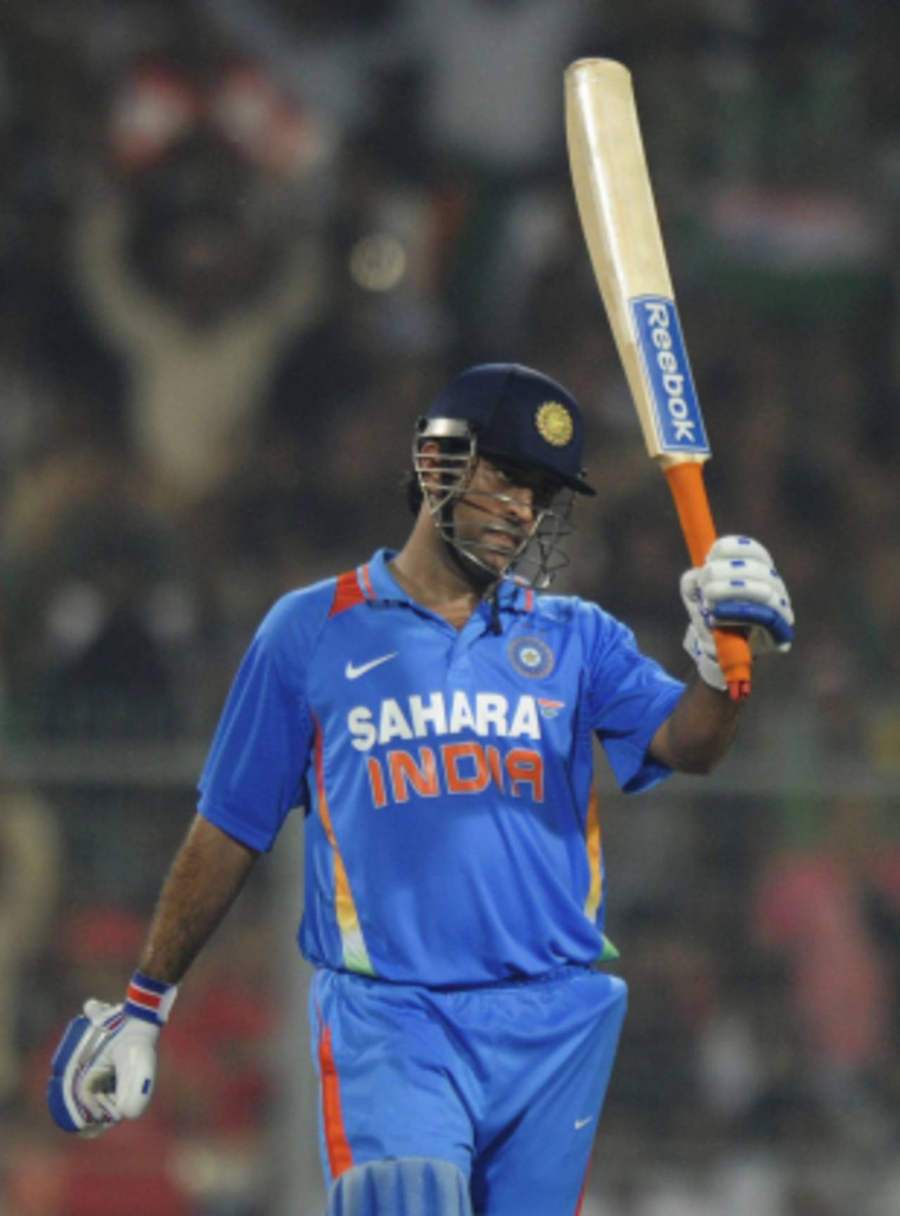 MS Dhoni raises his bat after reaching fifty, India v England, 5th ODI, Eden Gardens, October 25 2011