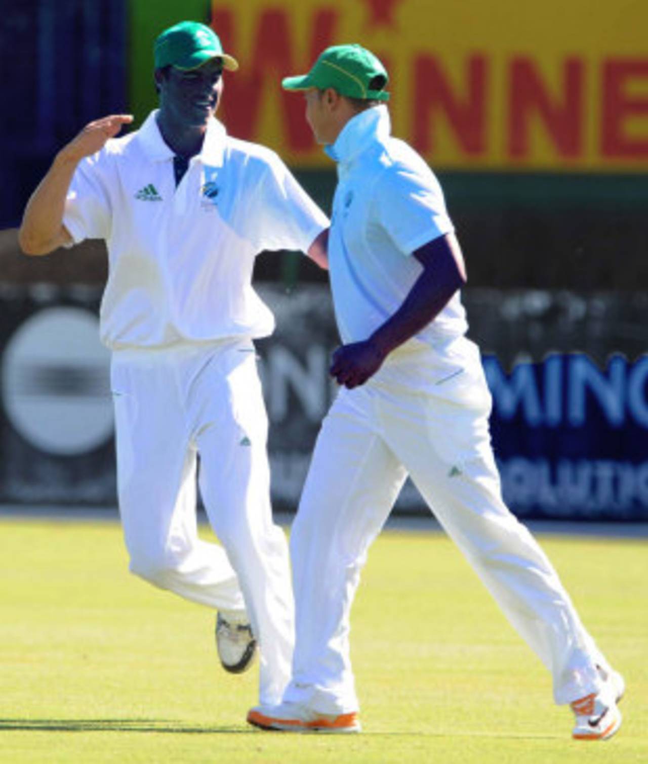 Marchant de Lange celebrates the wicket of Shane Watson with Alviro Petersen, South Africa A v Australians, 2nd day, Potchefstroom, November 2, 2011