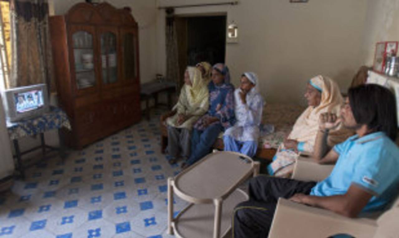 Mohammad Amir's family follows the sentencing process on television, Gujar Khan, Pakistan, November 3, 2011