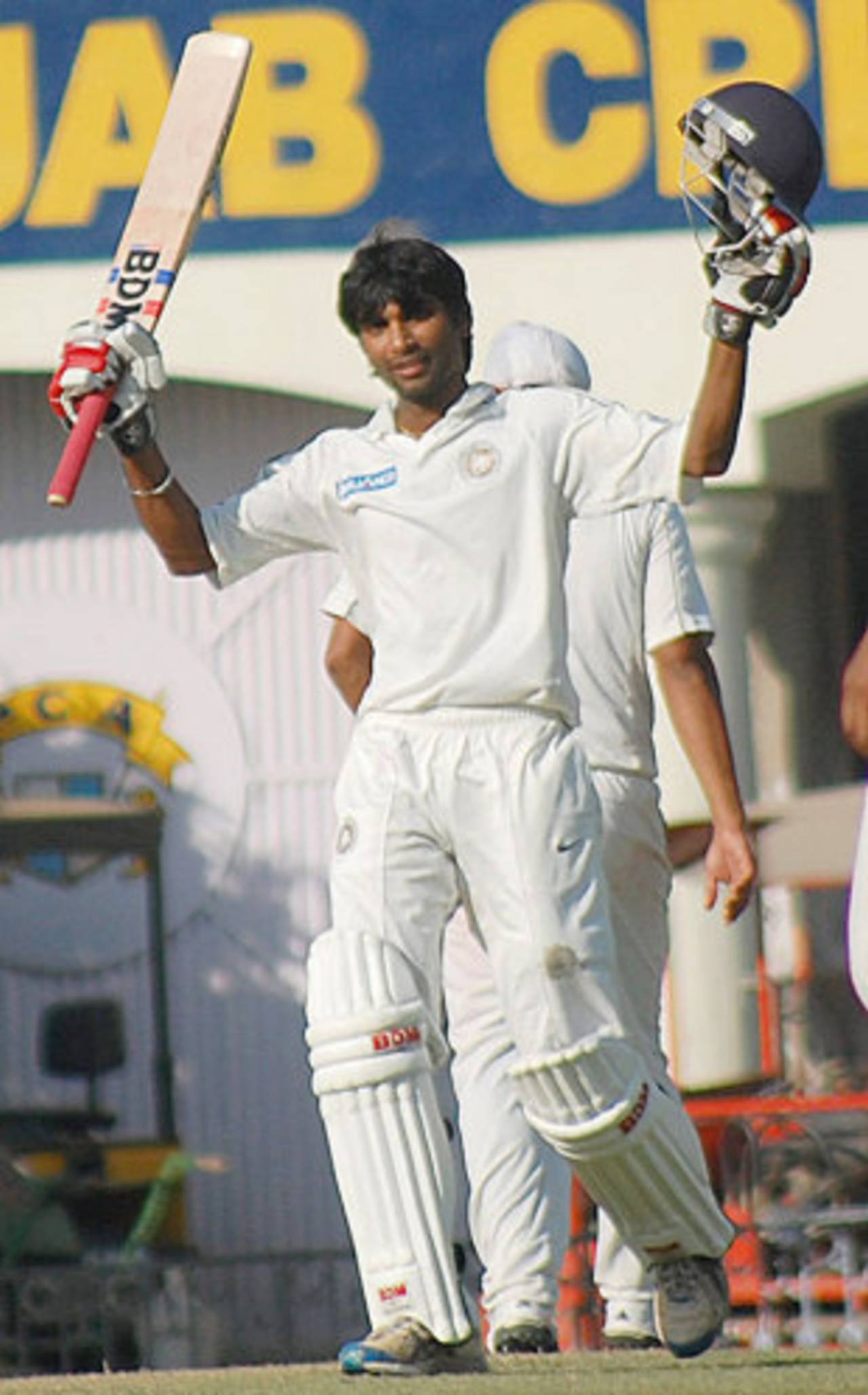 Sagar Jogiyani raises his bat after reaching a century, Punjab v Saurashtra, Mohali, Ranji Trophy Elite 2011-12, 3rd round, 1st day, November 17, 2011