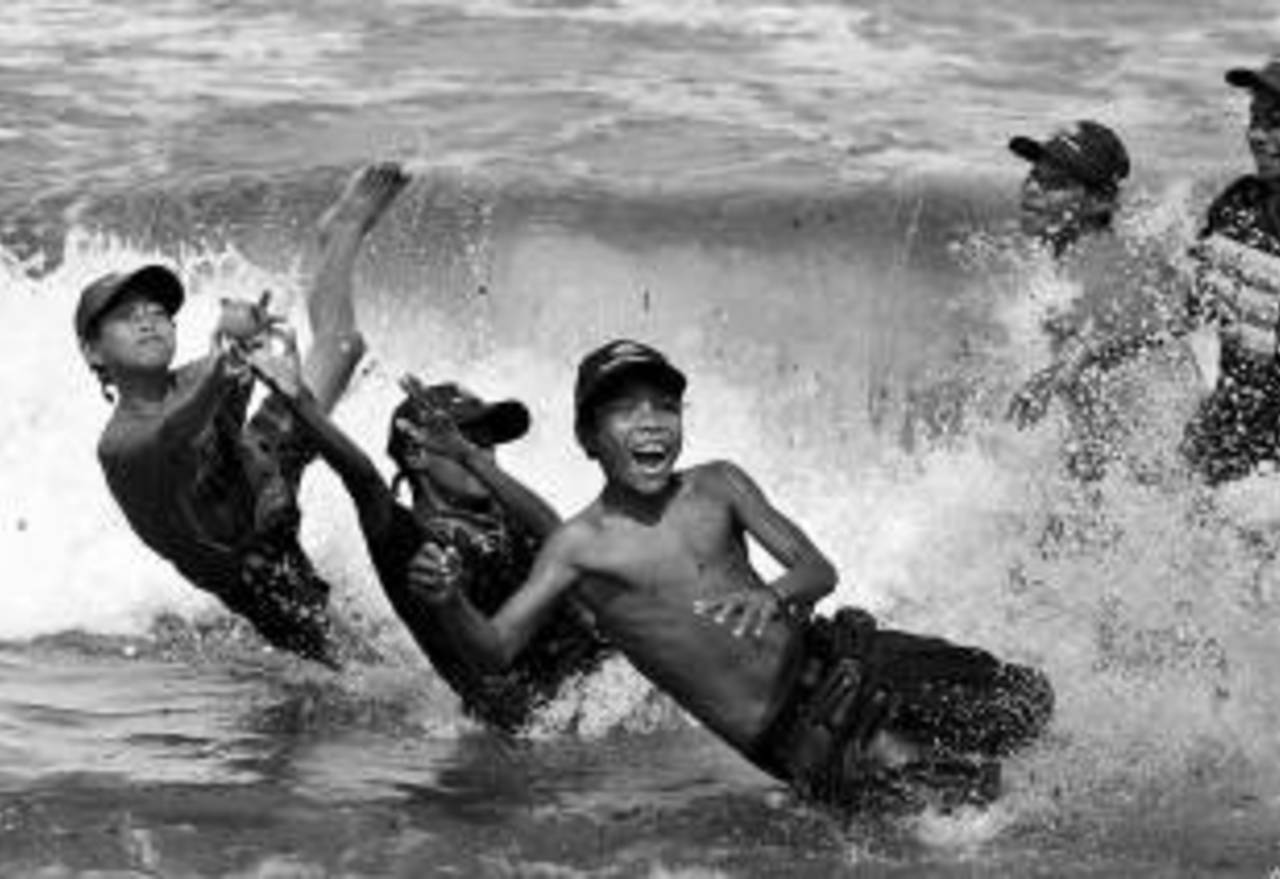 The award-winning photograph of children playing beach cricket in rural Papua New Guinea. Taken by Mark Dadswell, it won the award for Best Sport Photography at the 2011 Australian Sports Commission Media Awards