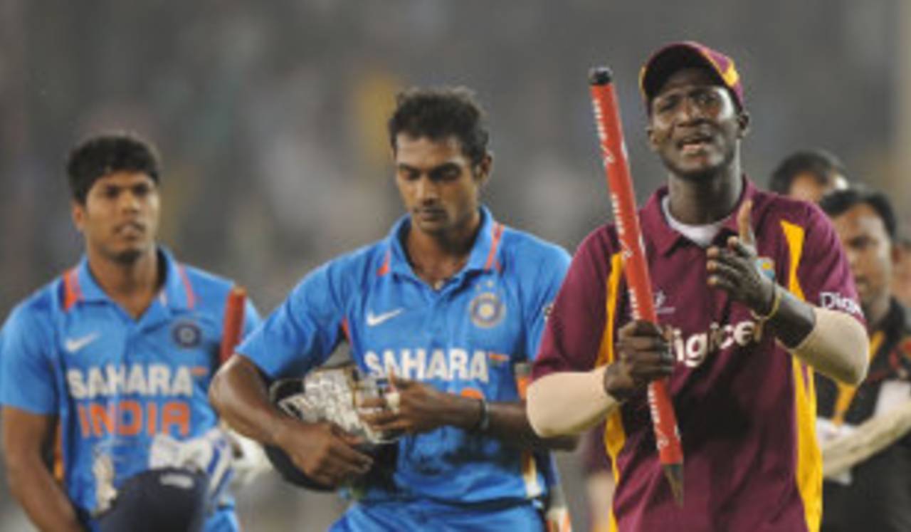 Darren Sammy takes a stump as a souvenir of West Indies' win, India v West Indies, 3rd ODI, Ahmedabad, December 5, 2011