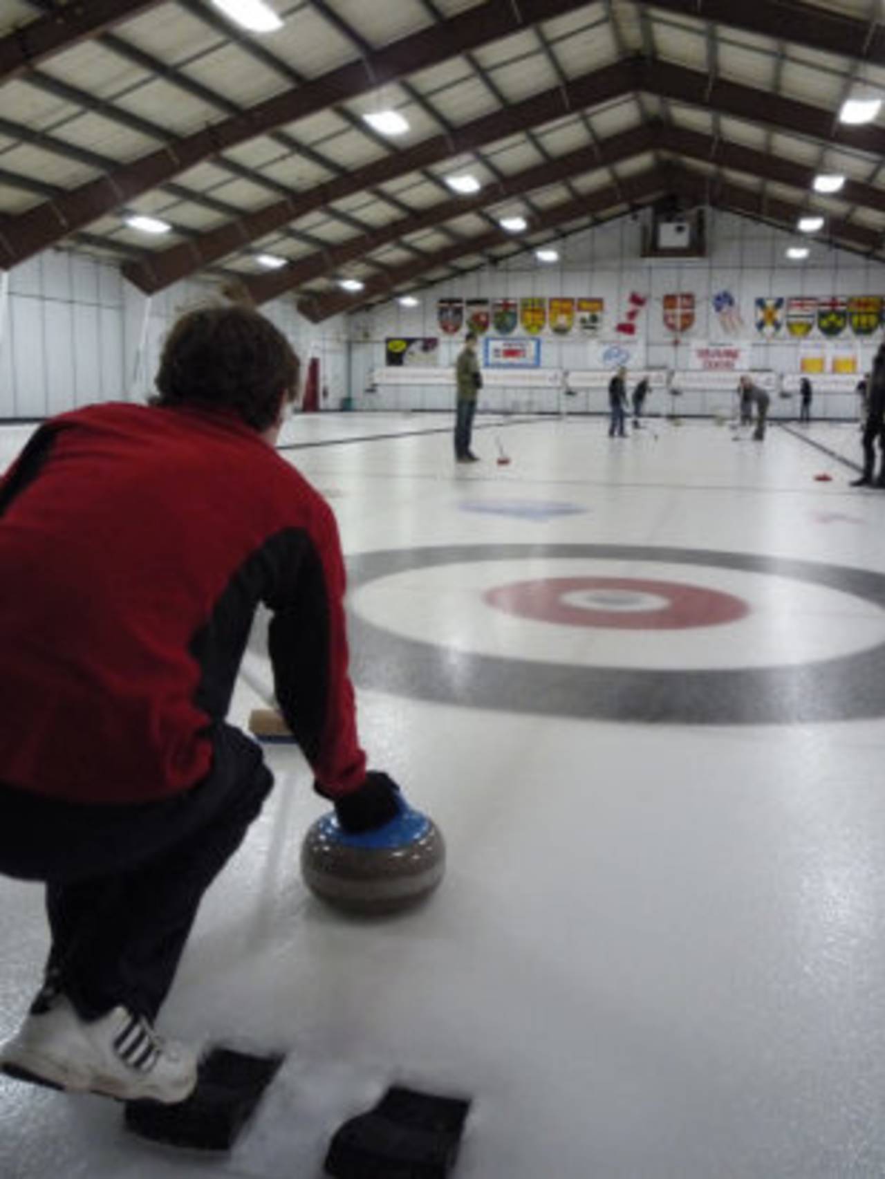 Liam Herringshaw tries his hand at curling