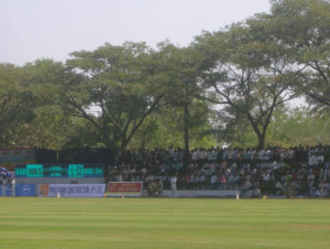 A crowd watches the first Ranji Trophy match at Shimoga's Jawaharlal Nehru National College of Engineering Ground, Karnataka v Uttar Pradesh, Ranji Trophy, Shimoga, December 21, 2011