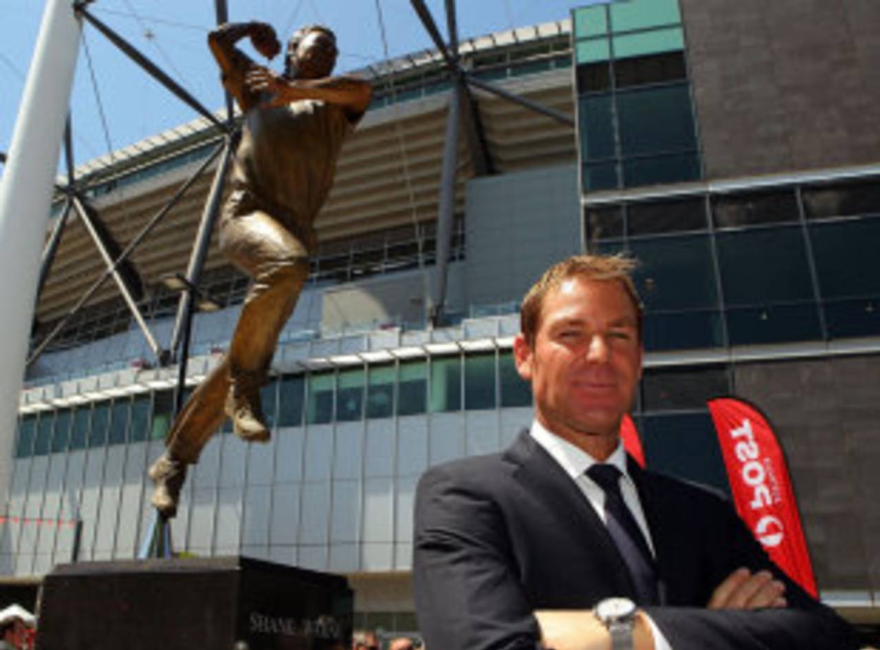 Shane Warne poses with a statue of himself unveiled at Melbourne Cricket Ground, December 22, 2011