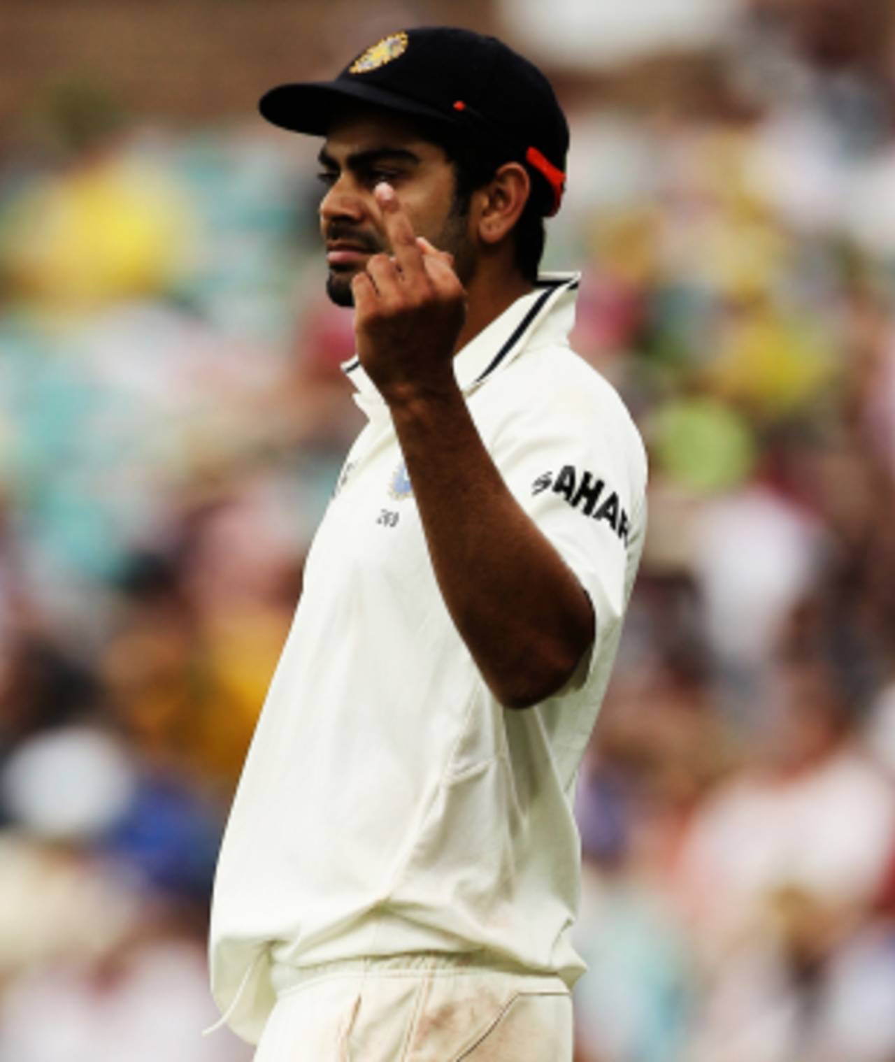 Virat Kohli gestures during a hard day in the field for India. He later tweeted that this was in response to provocation by the crowd, Australia v India, 2nd Test, Sydney, 2nd day, January 4, 2012