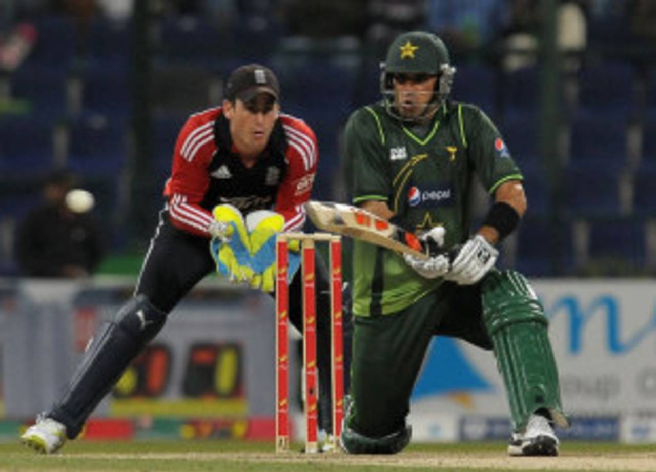 Misbah-ul-Haq reverse sweeps during his 14, Pakistan v England, 1st ODI, Abu Dhabi, February, 13, 2012