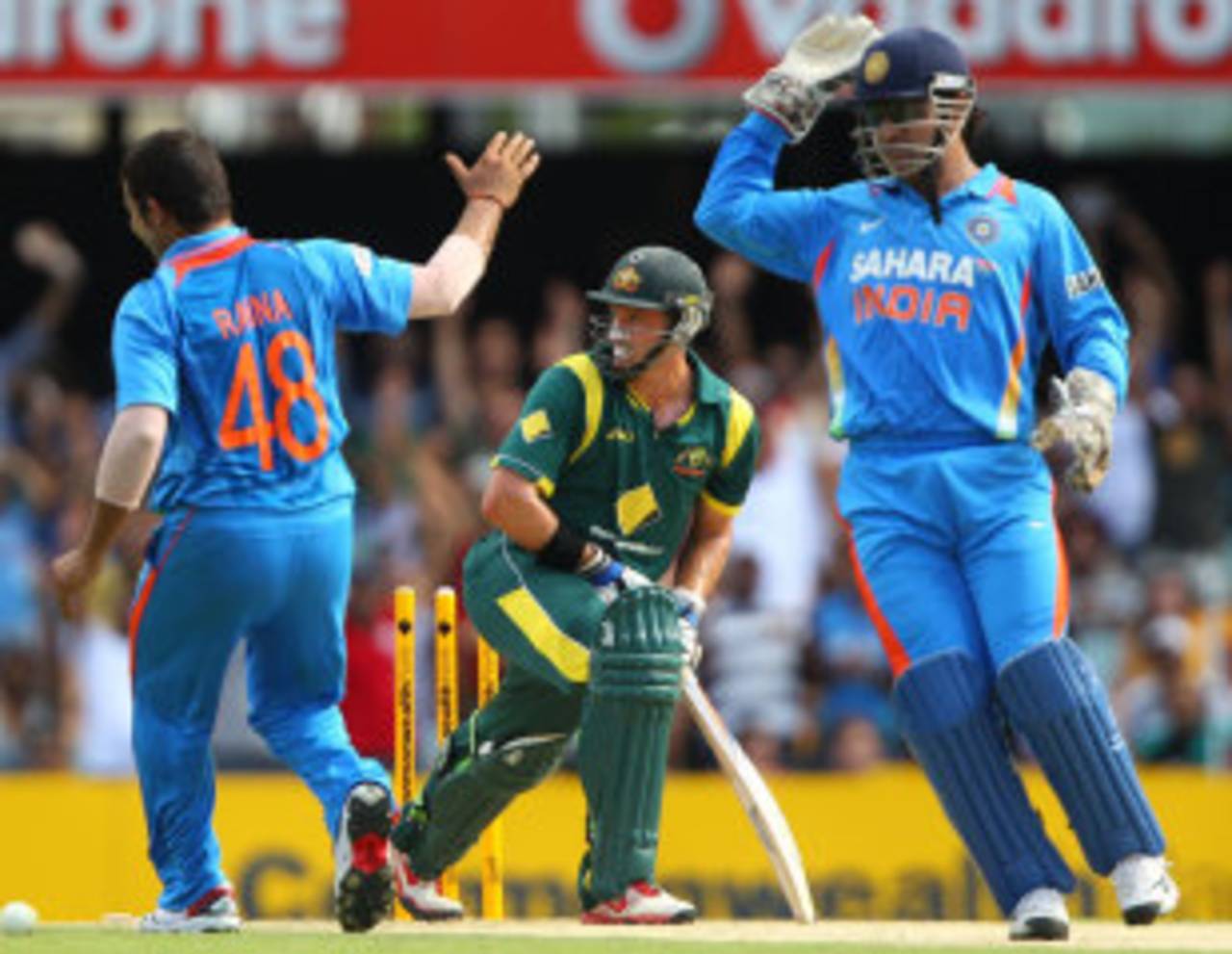 Michael Hussey is about to be wrongly ruled stumped by the third umpire, a decision that was quickly reversed, Australia v India, CB Series, Brisbane, February 19, 2012