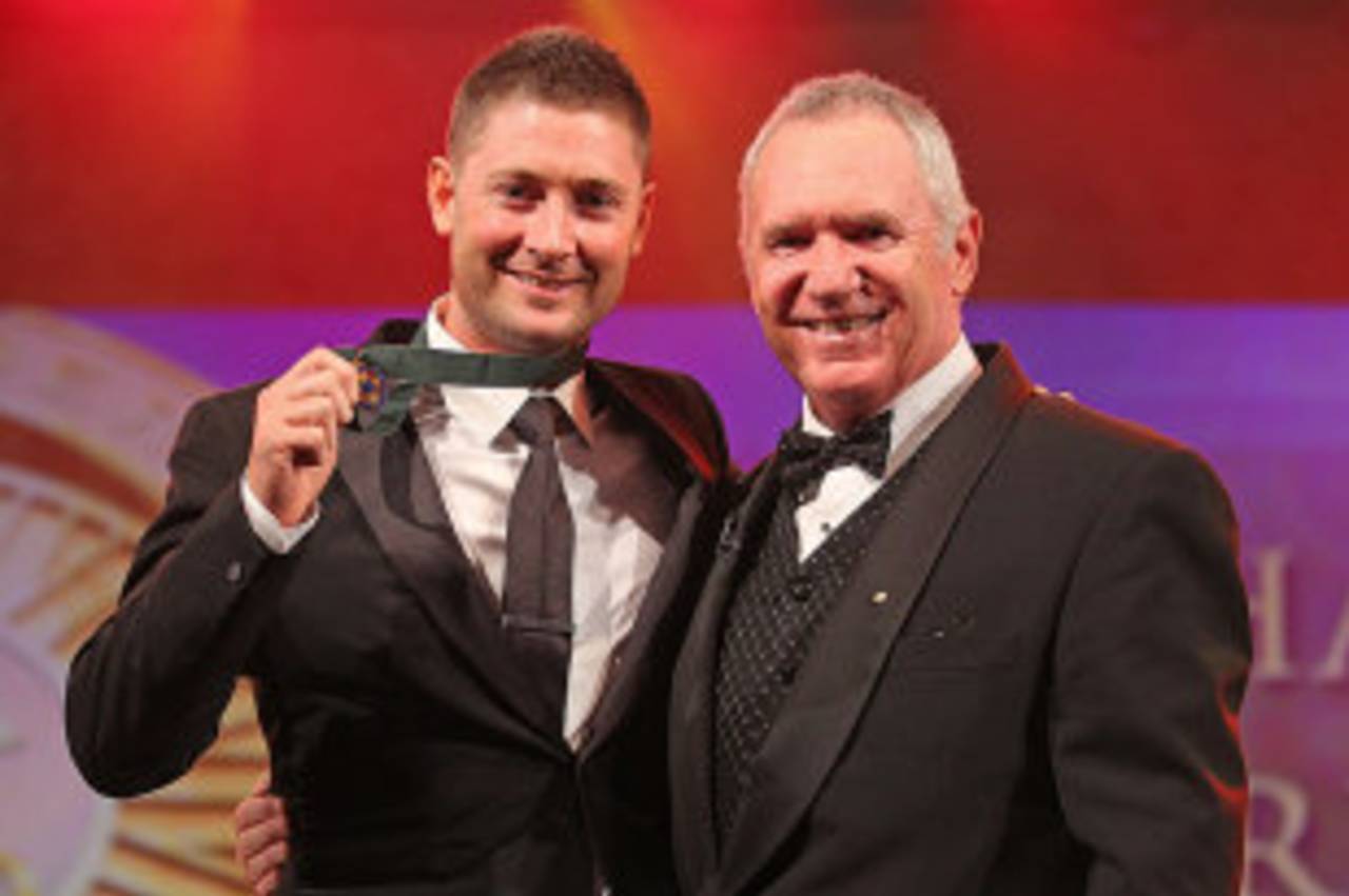 Michael Clarke shows off the Allan Border Medal after receiving it from the former Australia captain, Melbourne, February 27, 2012