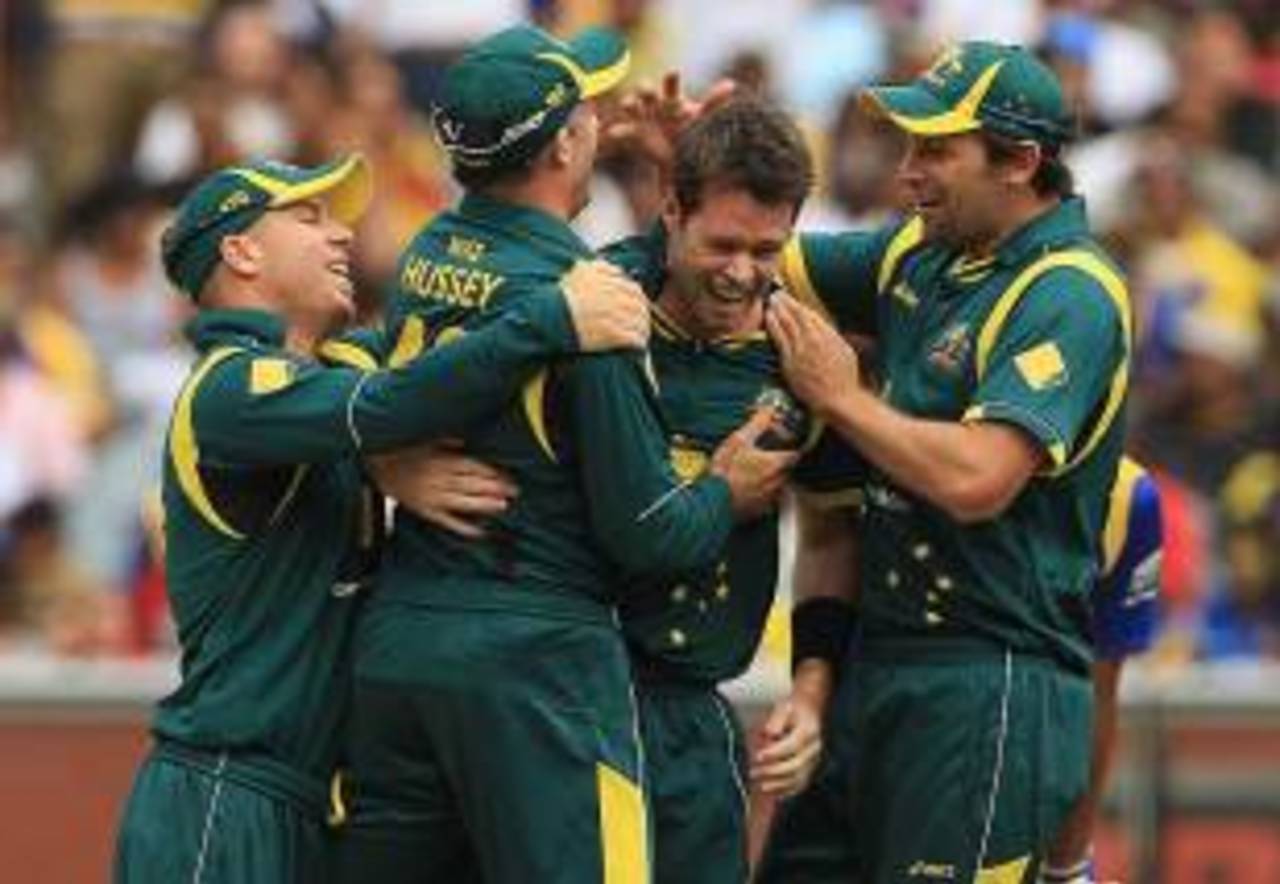 Daniel Christian is mobbed after claiming a hat-trick, Australia v Sri Lanka, CB series, Melbourne, March 2, 2012