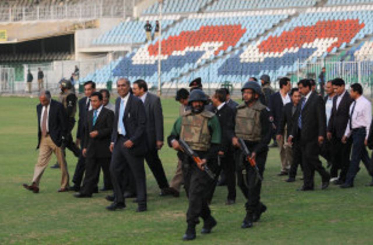 Officials of the Bangladesh and Pakistan boards are escorted onto the field at the Gaddafi Stadium, Lahore, March 4, 2012 