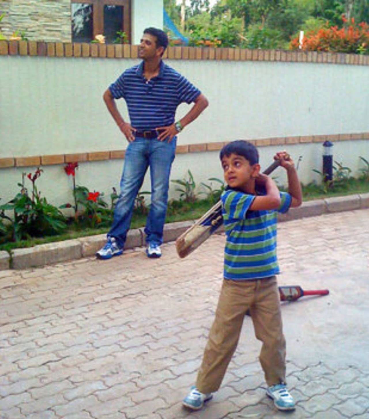 Rahul Dravid plays with son Samit outside their home in Bangalore, March 10, 2012