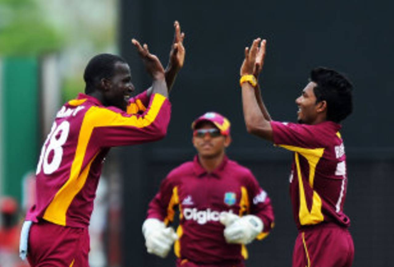 Darren Sammy celebrates a wicket with substitute fielder Devendra Bishoo, West Indies v Australia, 2nd ODI, St Vincent, March 18, 2012