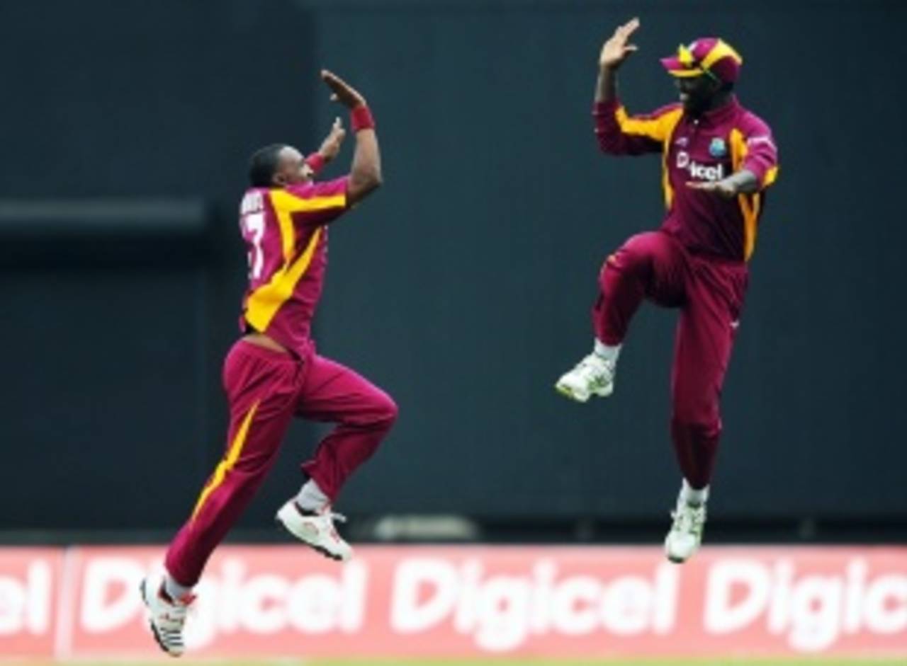 Dwayne Bravo and Darren Sammy celebrate George Bailey's wicket, West Indies v Australia, 2nd ODI, St Vincent, March 18, 2012