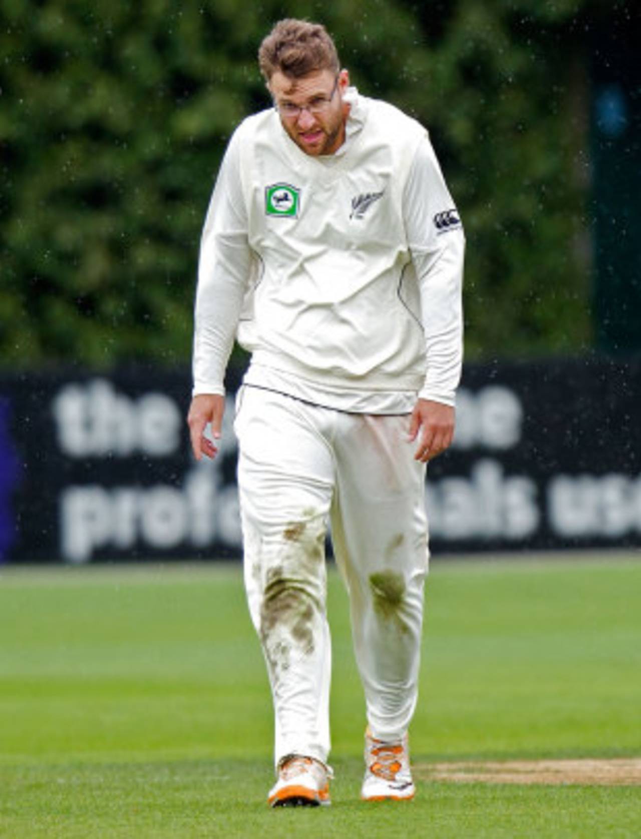 Daniel Vettori walks through the wind and rain, New Zealand v South Africa, 3rd Test, Wellington, 2nd day, March 24, 2012