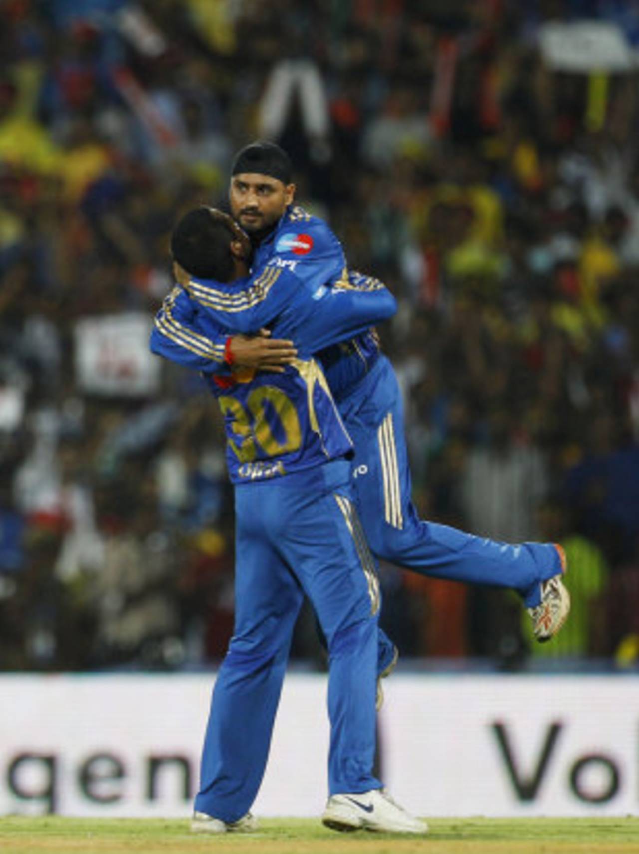 Pragyan Ojha gets a hug from his captain Harbhajan Singh, Super Kings v Mumbai Indians, IPL 2012, Chennai, April 4, 2012