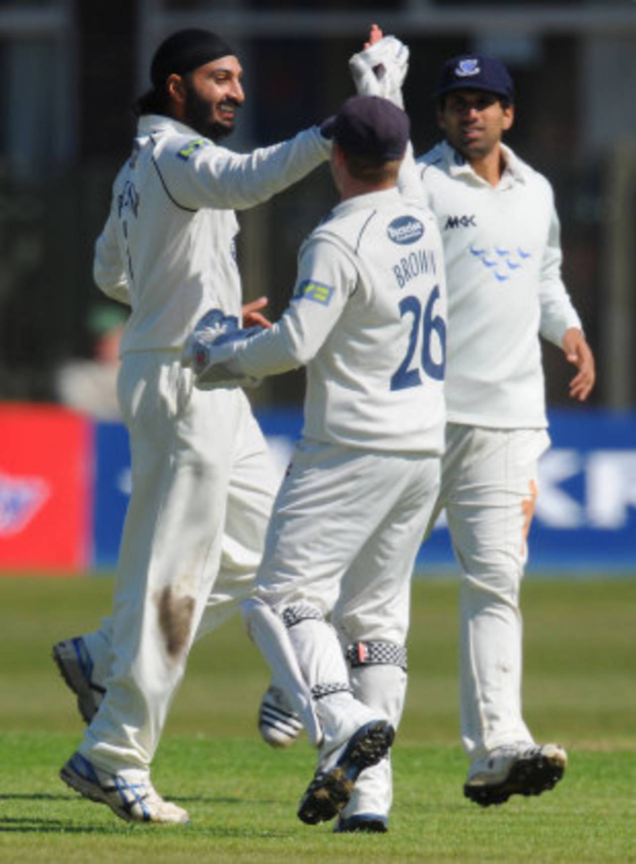Monty Panesar high fives Sussex wicketkeeper Ben Brown, Lancashire v Sussex, County Championship, Division One, Aigburth, April 12, 2012