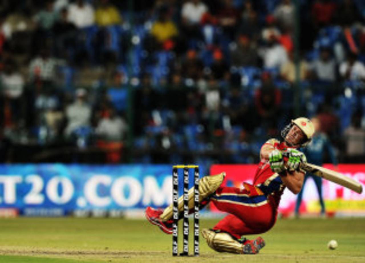 AB de Villiers trips while trying to hit a six, Royal Challengers Bangalore v Pune Warriors, IPL, Bangalore, April 17, 2012