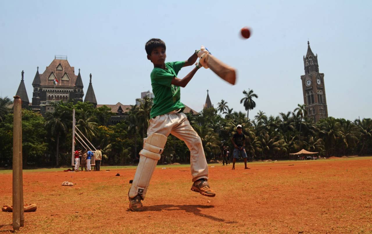 A boy practising at Oval Maidan, Mumbai