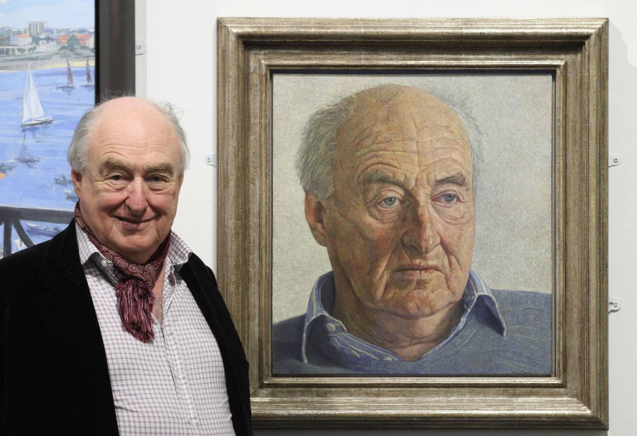 Henry Blofeld with a portrait of himself at the Royal Society of Portrait Painters, London, May 2, 2012 