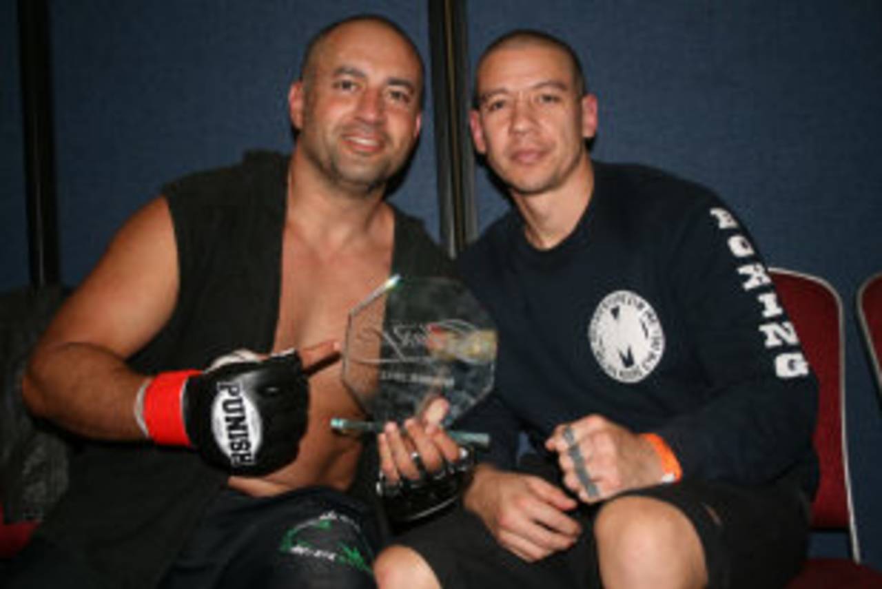 Adam Hollioake (left) with his mixed martial arts coach Stephen Ng, 2012