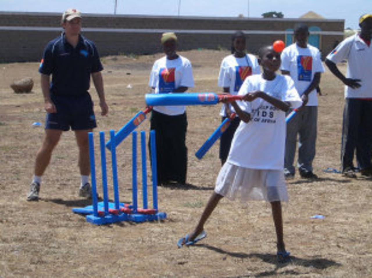 Thika, Kenya: Ed Williams keeps wicket as Eva, an AIDS-affected child, bats&nbsp;&nbsp;&bull;&nbsp;&nbsp;Cricket without Boundaries