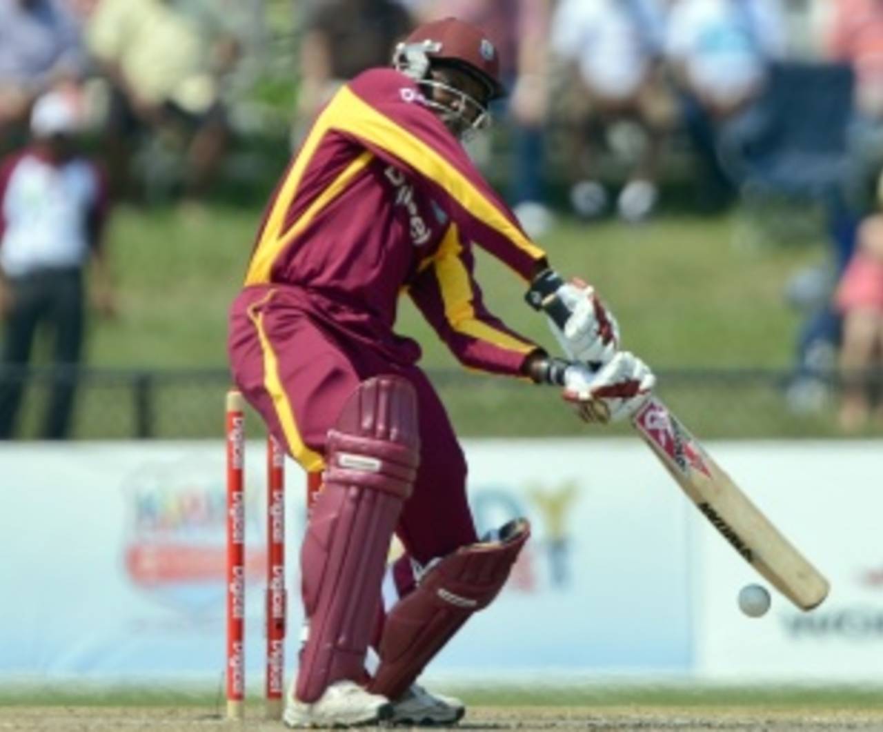 Chris Gayle tries to blast through the off side, West Indies v New Zealand, 1st Twenty20, Florida, June 30, 2012