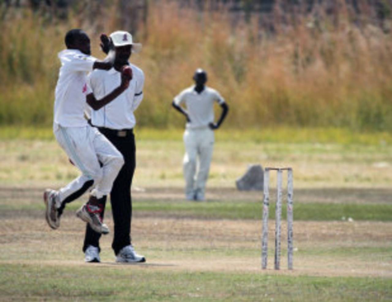 A bowler bowls in a club game in Zimbabwe