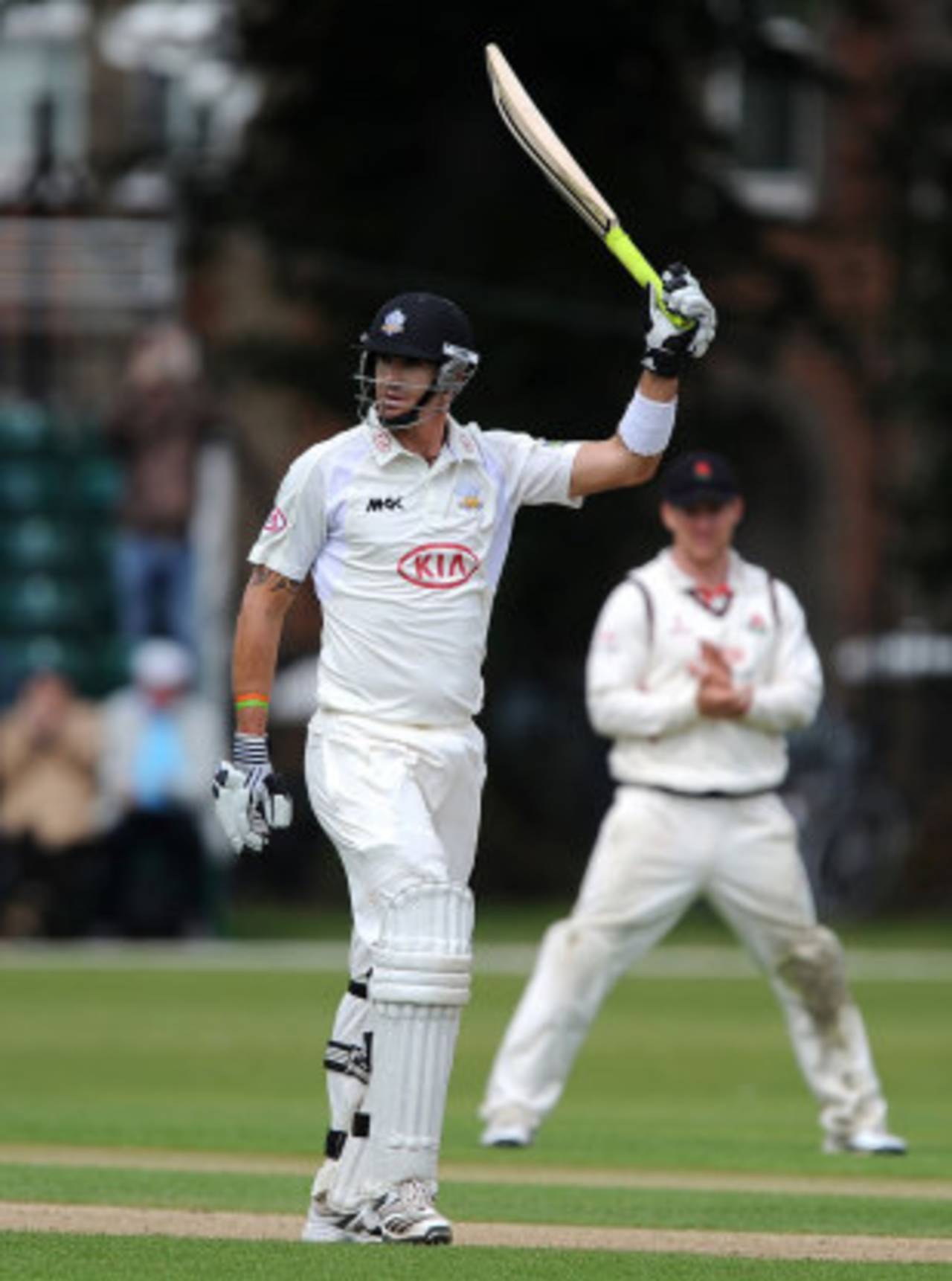 Kevin Pietersen raises his bat after reaching his century, Surrey v Lancashire, County Championship, Division One, 3rd day, Guildford, July 11, 2012