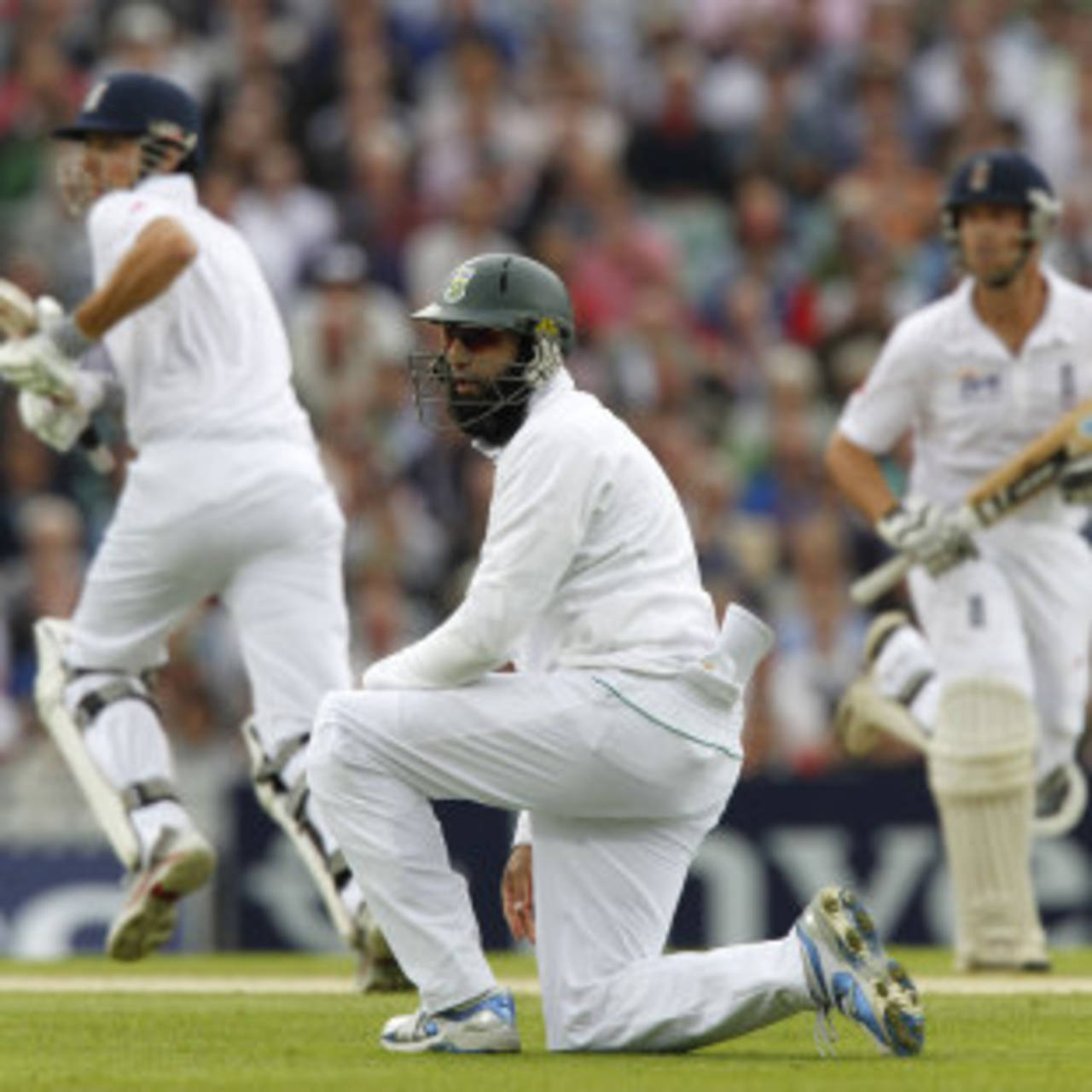 Hashim Amla looks on as Alastair Cook and Jonathan Trott take a run, England v South Africa, 1st Investec Test, The Oval, 1st day, July 19, 2012