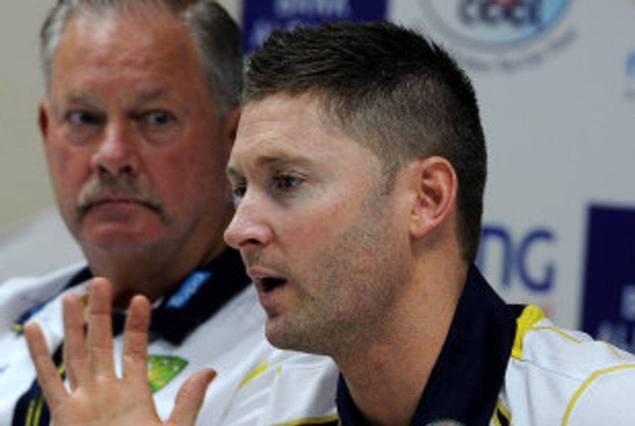 Michael Clarke speaks to the media as Steve Rixon looks on, Sharjah, August 26, 2012