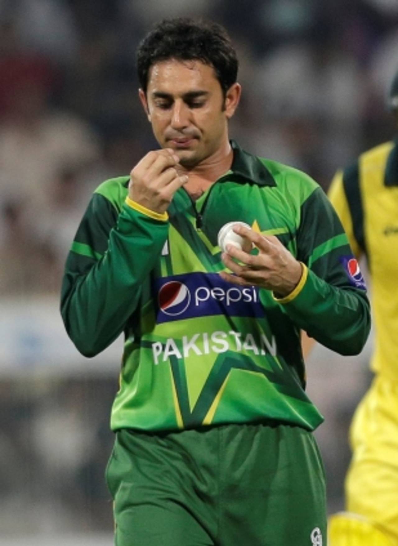 As part of his act aimed at getting onto the ICC shortlist, Saeed Ajmal pulls a ball out of his throat on an invisible piece of string&nbsp;&nbsp;&bull;&nbsp;&nbsp;Associated Press