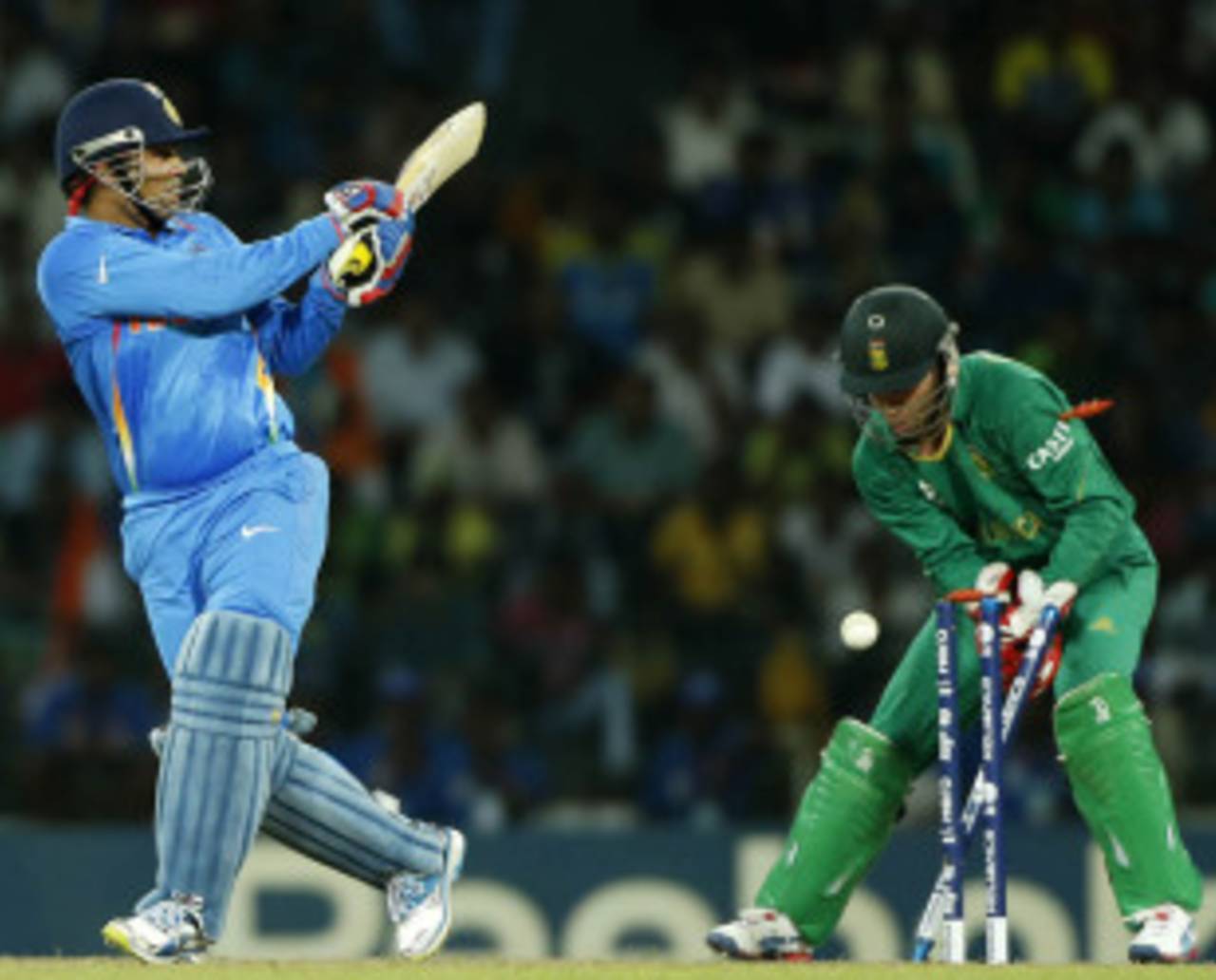 Virender Sehwag looks back to see his stumps disturbed after attempting a wild shot&nbsp;&nbsp;&bull;&nbsp;&nbsp;Associated Press