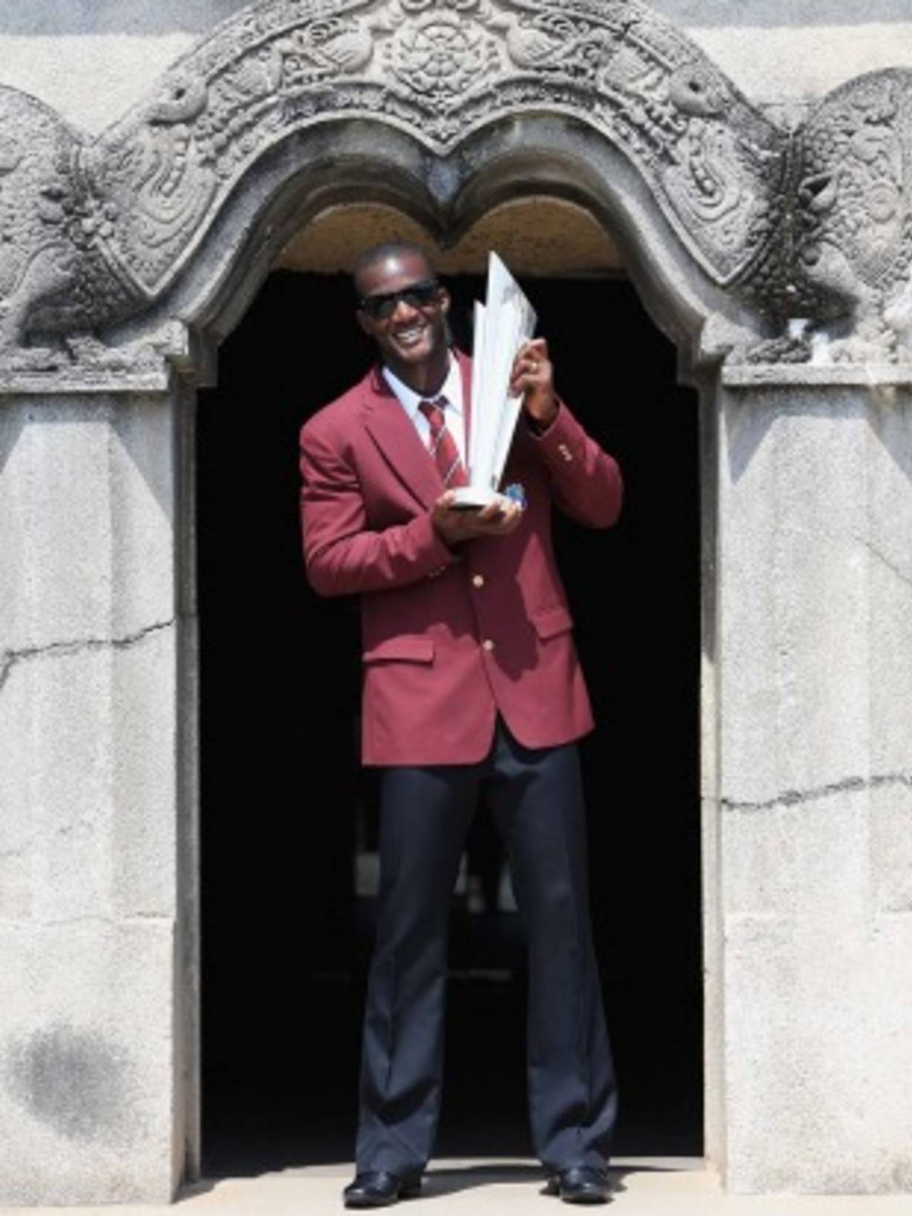 Darren Sammy is available for photographs with the World Twenty20 trophy by the gates of his home every morning for the next three years&nbsp;&nbsp;&bull;&nbsp;&nbsp;ICC/Getty