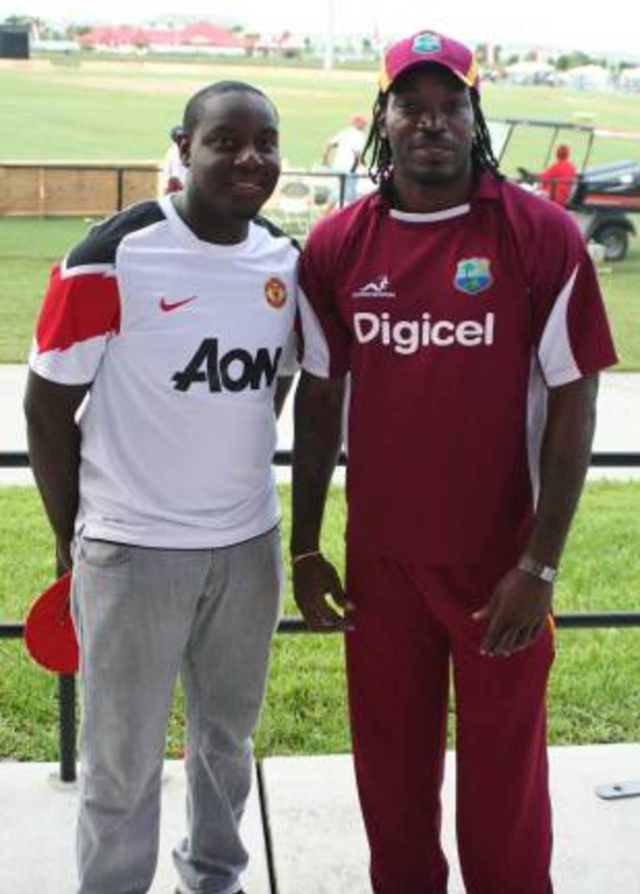 Steven Taylor poses for a photograph with Chris Gayle, Florida, July 1, 2012