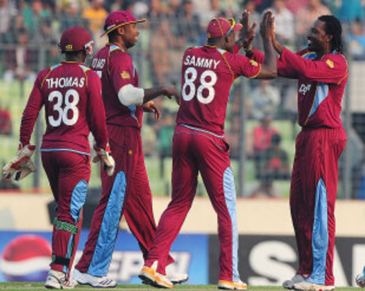 Chris Gayle and his team-mates celebrate a wicket, Bangladesh v West Indies, 3rd ODI, Mirpur, December 5, 2012