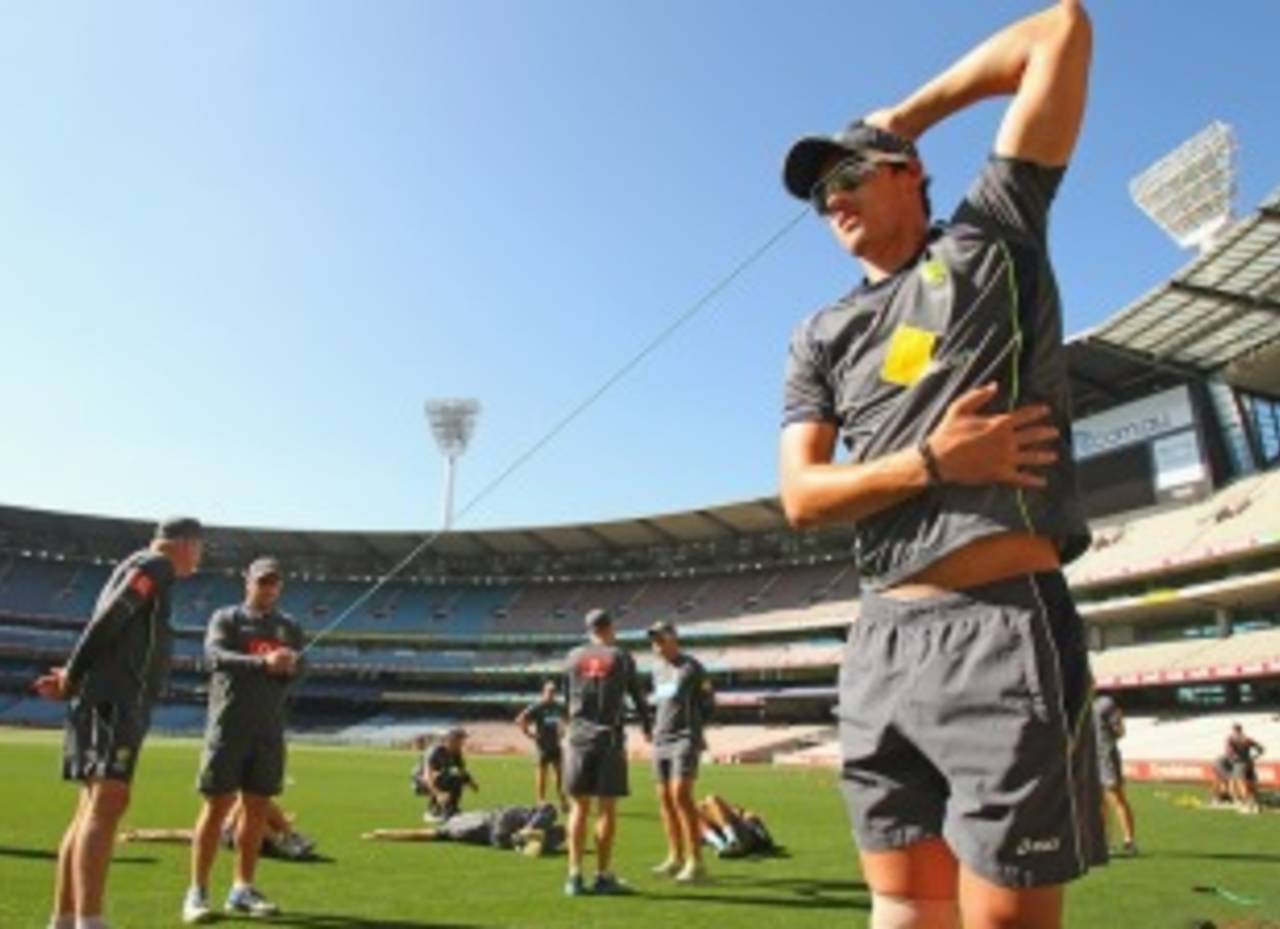 Mitchell Starc stretches at a training session on the eve of the first ODI against Sri Lanka, Melbourne, January 10, 2013