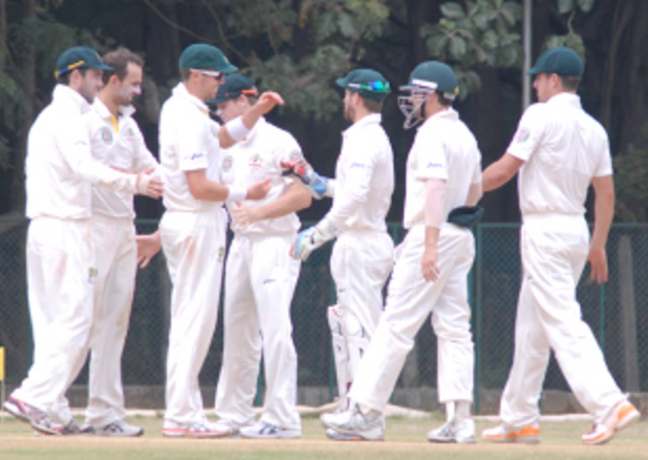 The Australians celebrate a wicket, Indian Board President's XI v Australians, 2nd day, Chennai, February 13, 2013