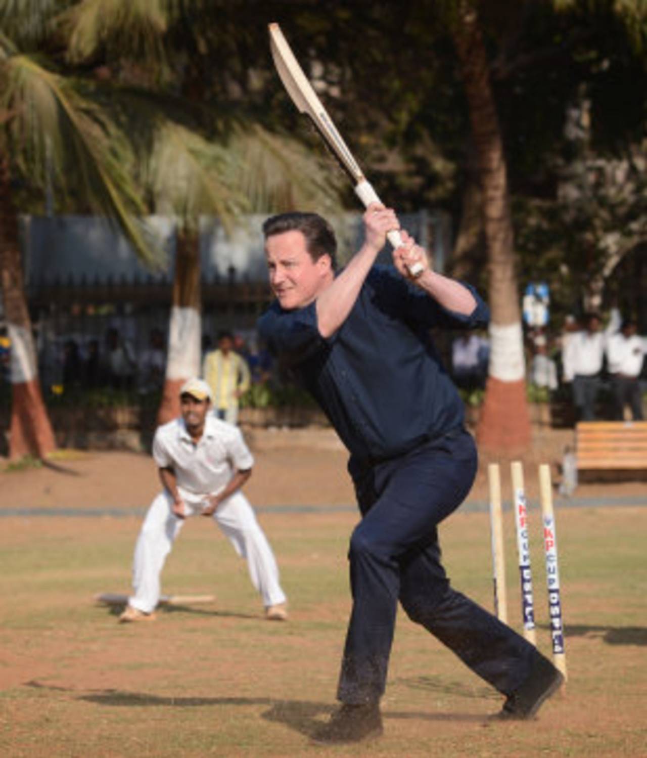 David Cameron plays cricket during a trip to India, Mumbai, February 18, 2013