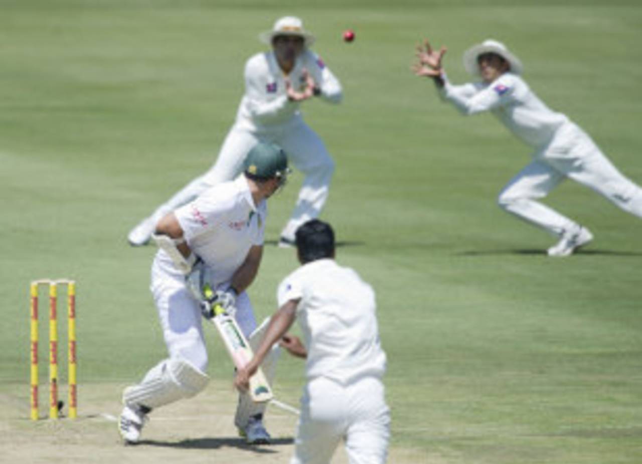 Graeme Smith watches Younis Khan dive in front of Misbah-ul-Haq to take the catch off Ehsan Adil's bowling&nbsp;&nbsp;&bull;&nbsp;&nbsp;Associated Press