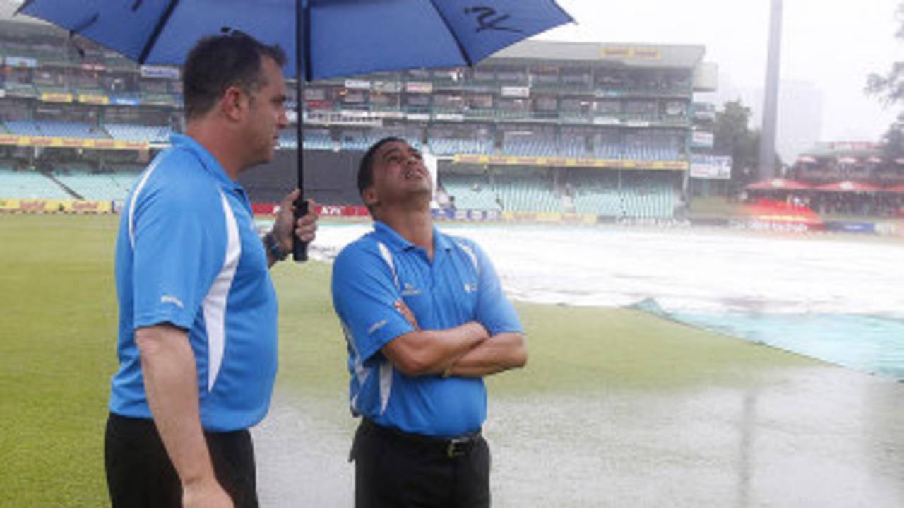 Umpires Adrian Holdstock and Shaun George take stock of the ground at Durban, South Africa v Pakistan, 1st T20I, Durban, March 1, 2013 