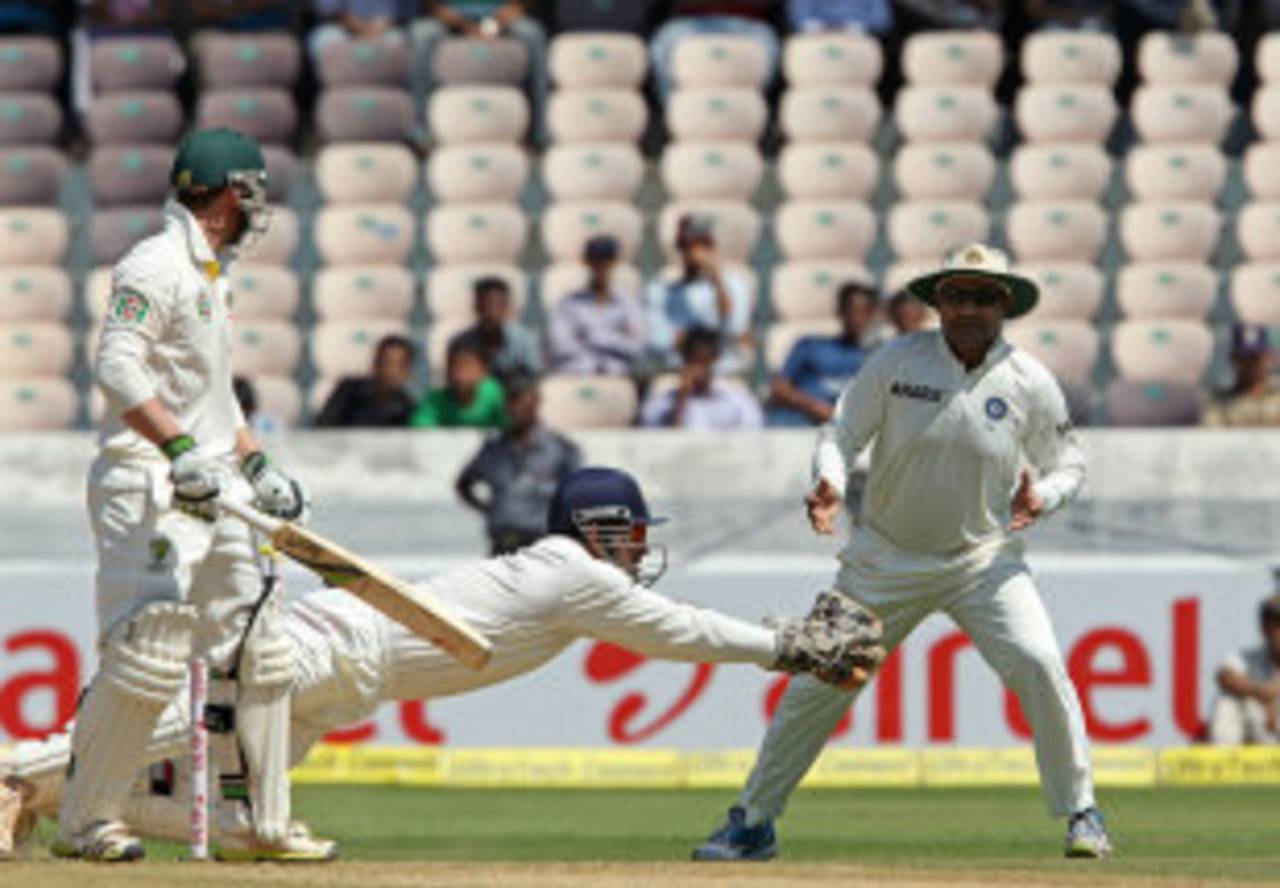 MS Dhoni reaches out to catch Phillip Hughes, India v Australia, 2nd Test, Hyderabad, 1st day, March 2, 2013