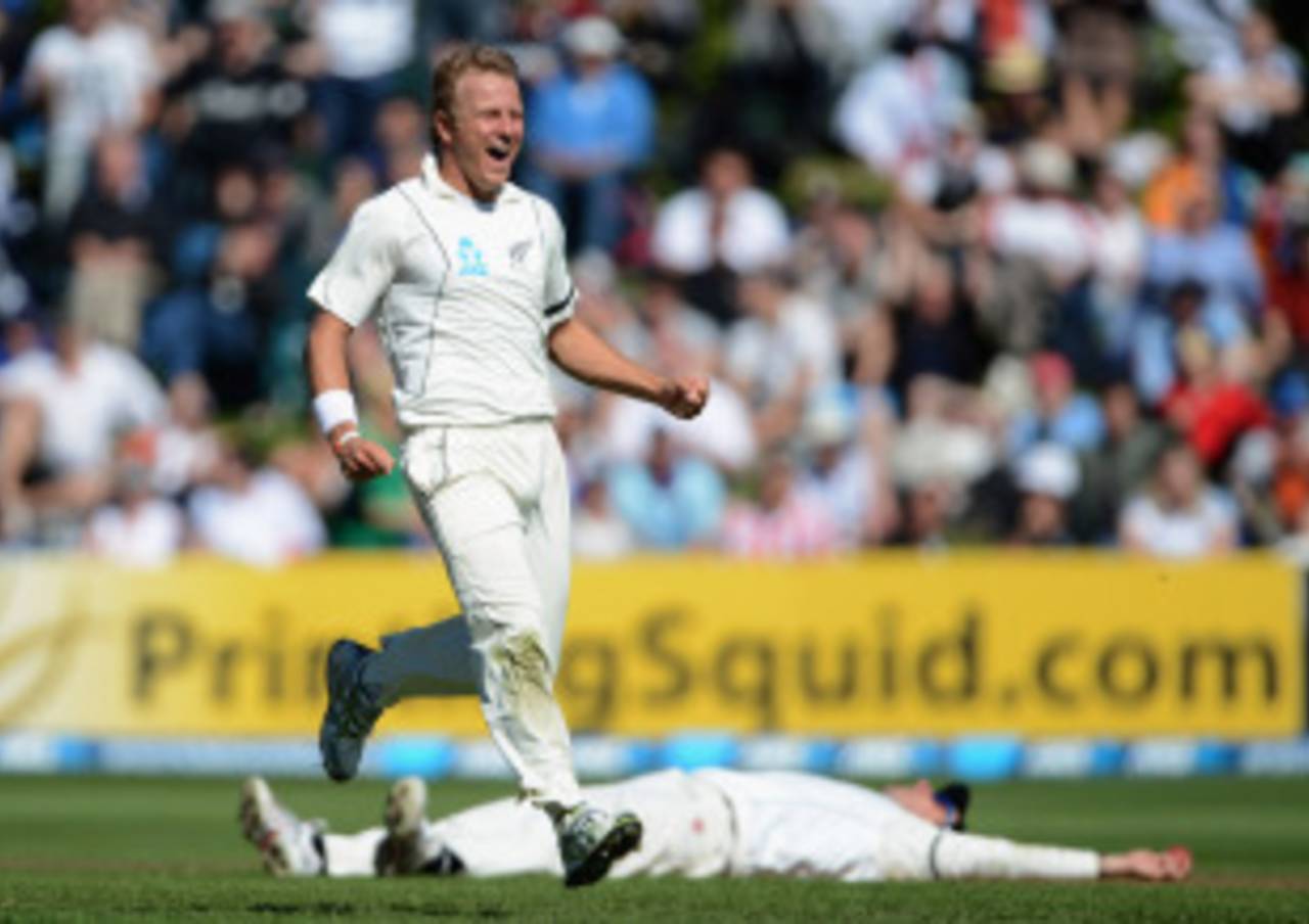 Hamish Rutherford lies on the ground behind Neil Wagner after taking a catch, New Zealand v England, 1st Test, Dunedin, 2nd day, March 7, 2013
