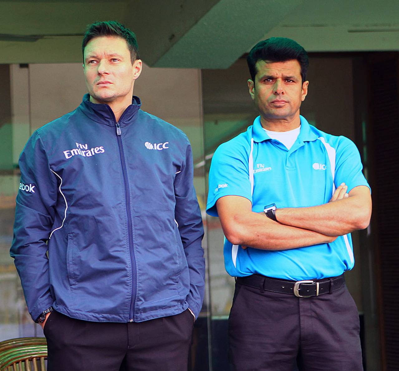 Umpires Richard Kettleborough and Aleem Dar wait for the weather to clear, India v Australia, 3rd Test, 1st day, Mohali, March 14, 2013