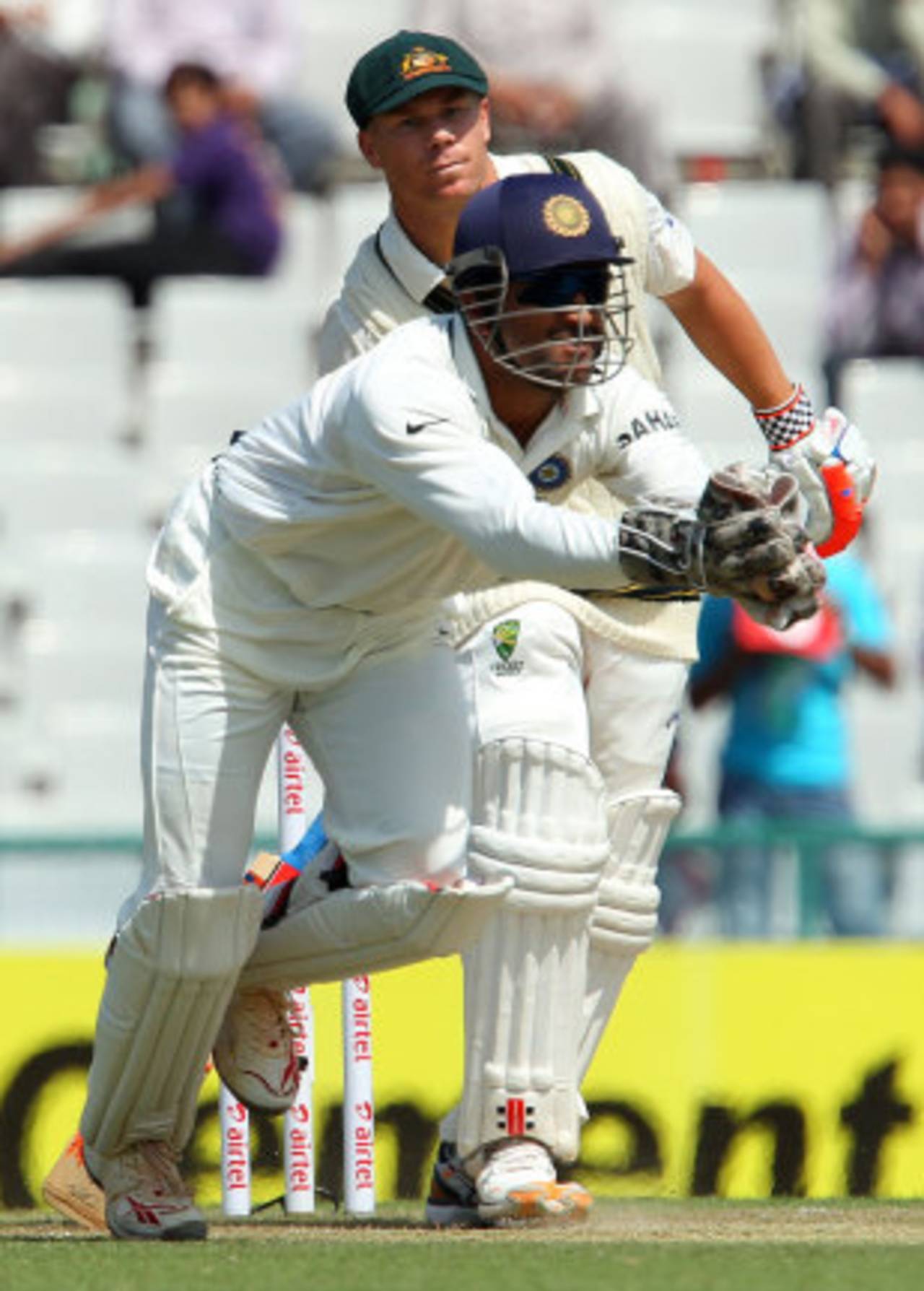 MS Dhoni completes a bat-pad catch off David Warner, India v Australia, 3rd Test, Mohali, 2nd day, March 15, 2013