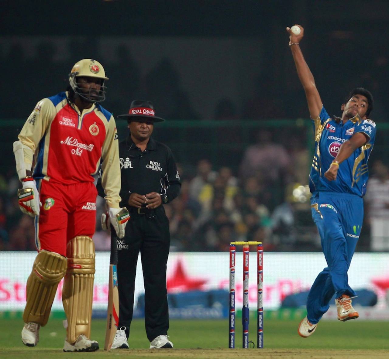 In elite company: Jasprit Bumrah bowls during his debut match, Royal Challengers Bangalore v Mumbai Indians, IPL, Bangalore, April 4, 2013