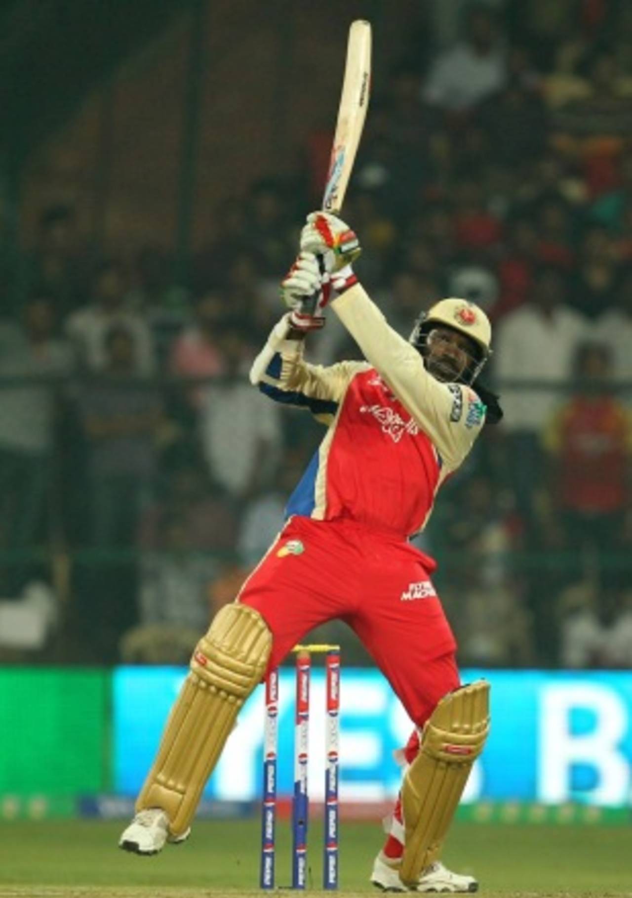Chris Gayle launches one back over the bowler's head, Royal Challengers Bangalore v Mumbai Indians, IPL, Bangalore, April 4, 2013