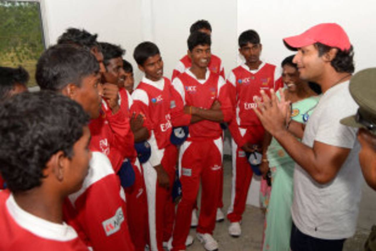 Kumar Sangakkara talks to the Mullaitivu Combined Schools team before their first match in the Murali Cup, 2012