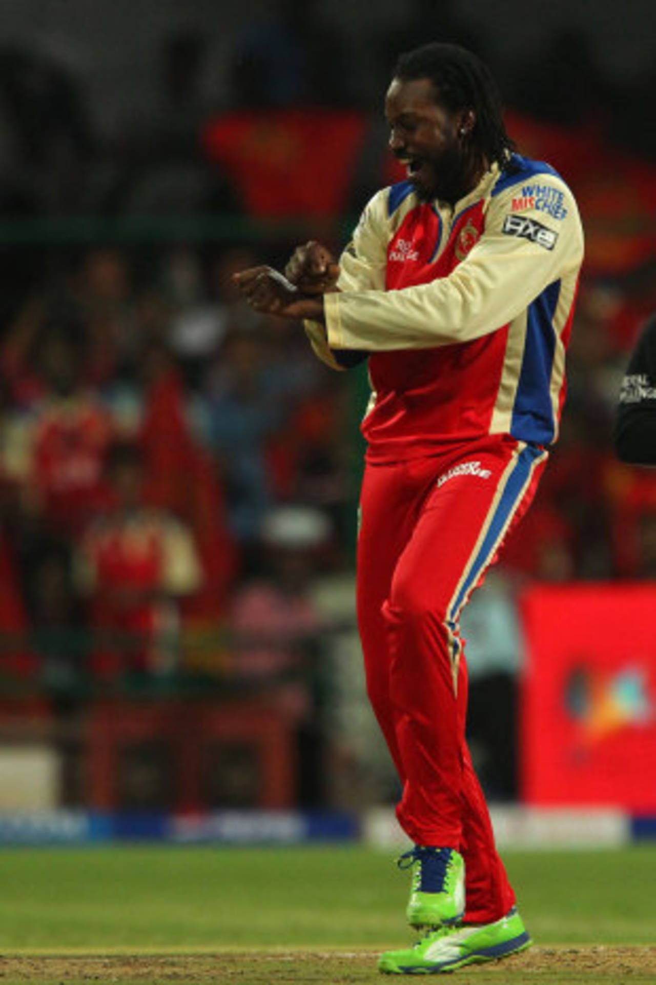 Chris Gayle celebrates a wicket with <i>Gangnam Style</i>, Royal Challengers Bangalore v Pune Warriors, IPL, Bangalore, April 23, 2013