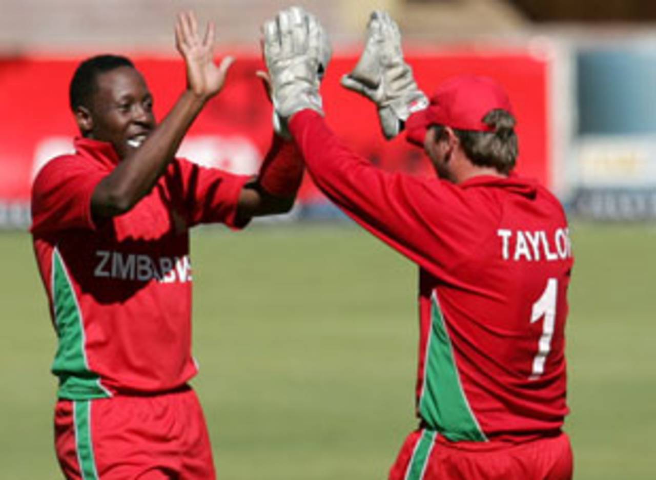 Shingi Masakadza celebrates a wicket with Brendan Taylor, Zimbabwe v Bangladesh, 1st ODI, Bulawayo, May 3, 2013